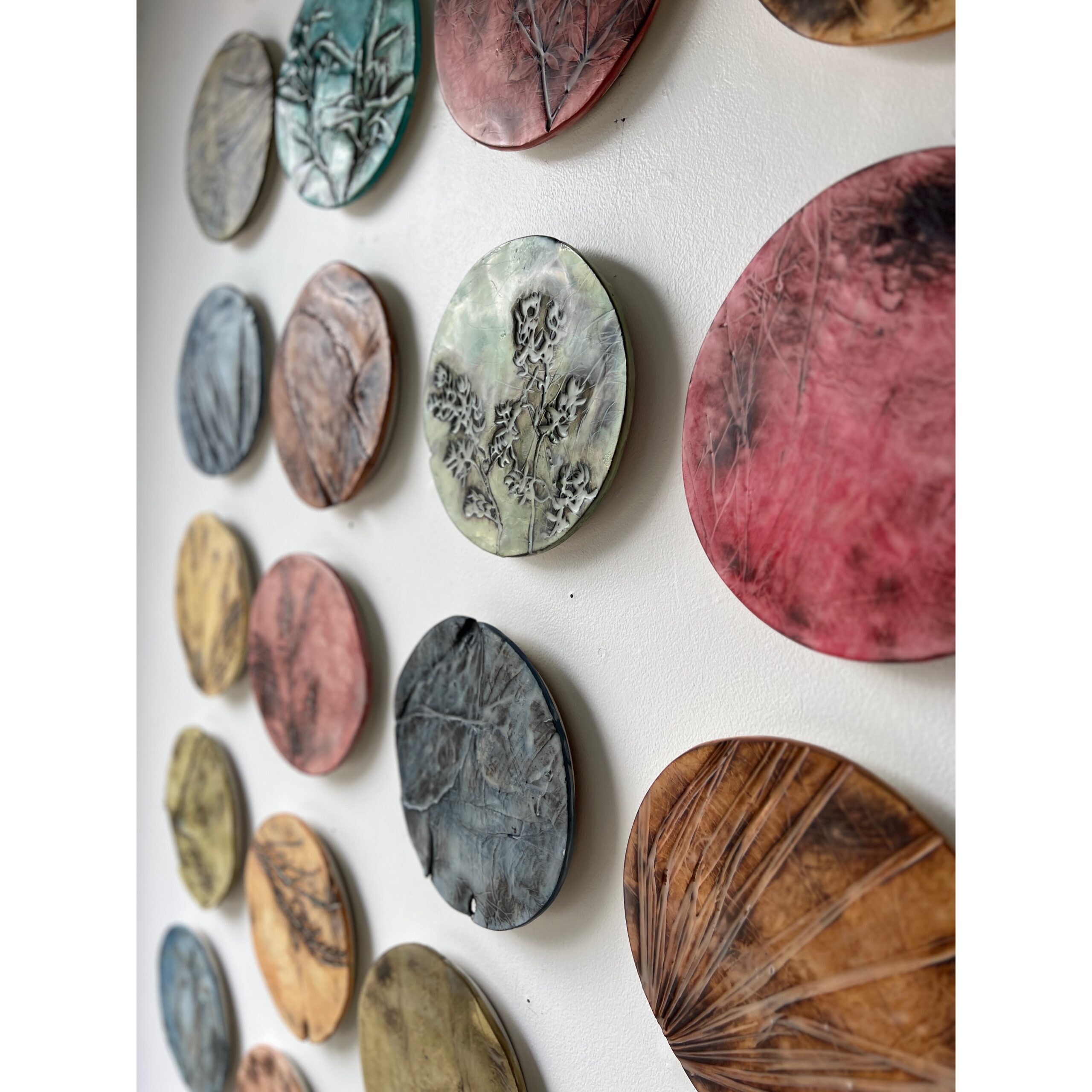 series of 36 paperclay dimensional wall works | Japanese paperclay inlaid with desert inspired botanicals, flame embellished, with watercolor and encaustic wax finish | 10" dia each