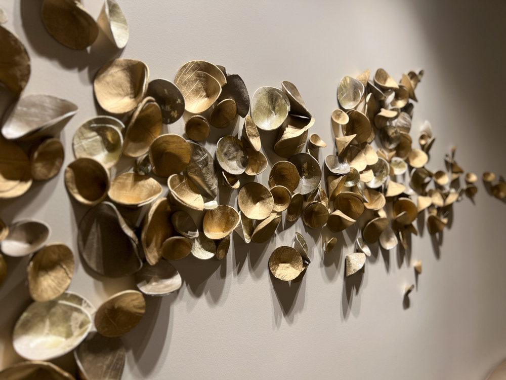 Direct to wall installation for Four Season Atlanta Spa, custom paperclay Cuppies in mixed metallics, approximately 18" x 72" area | Consulting by Canvas Atlanta