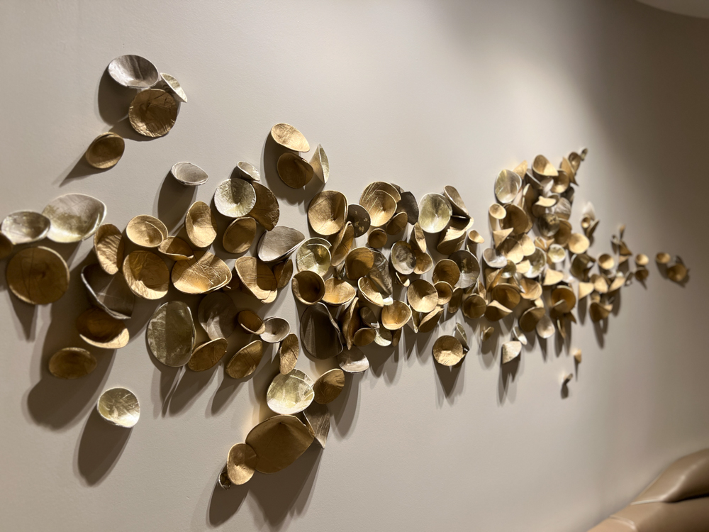 Direct to wall installation for Four Season Atlanta Spa, custom paperclay Cuppies in mixed metallics, approximately 18" x 72" area | Consulting by Canvas Atlanta