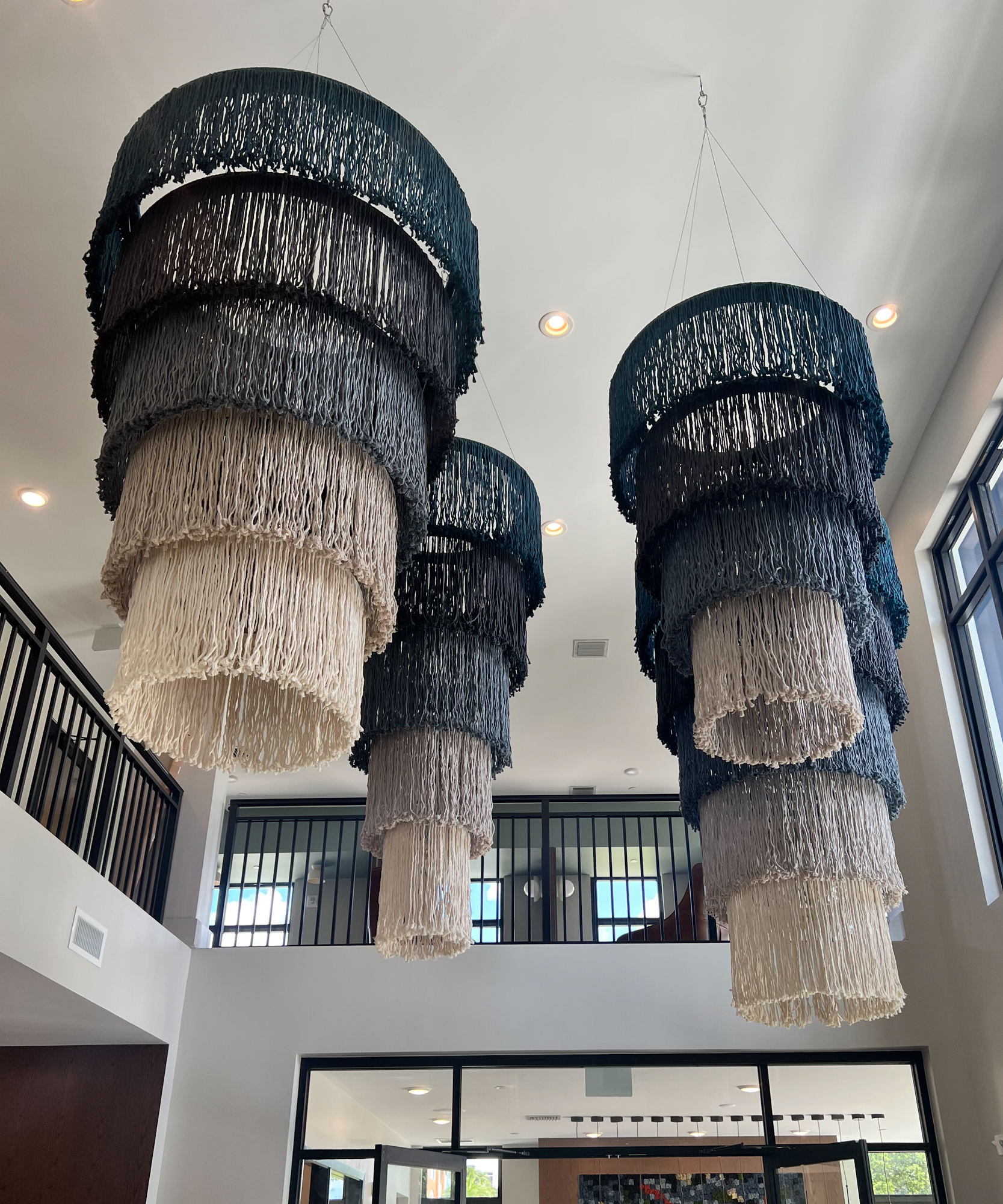 Large Scale Suspended Sculpture, custom wood forms, steel cable and hardware, cotton cording, install installed in mixed use residential in Miramar, Florida | Design by Level Design Studio