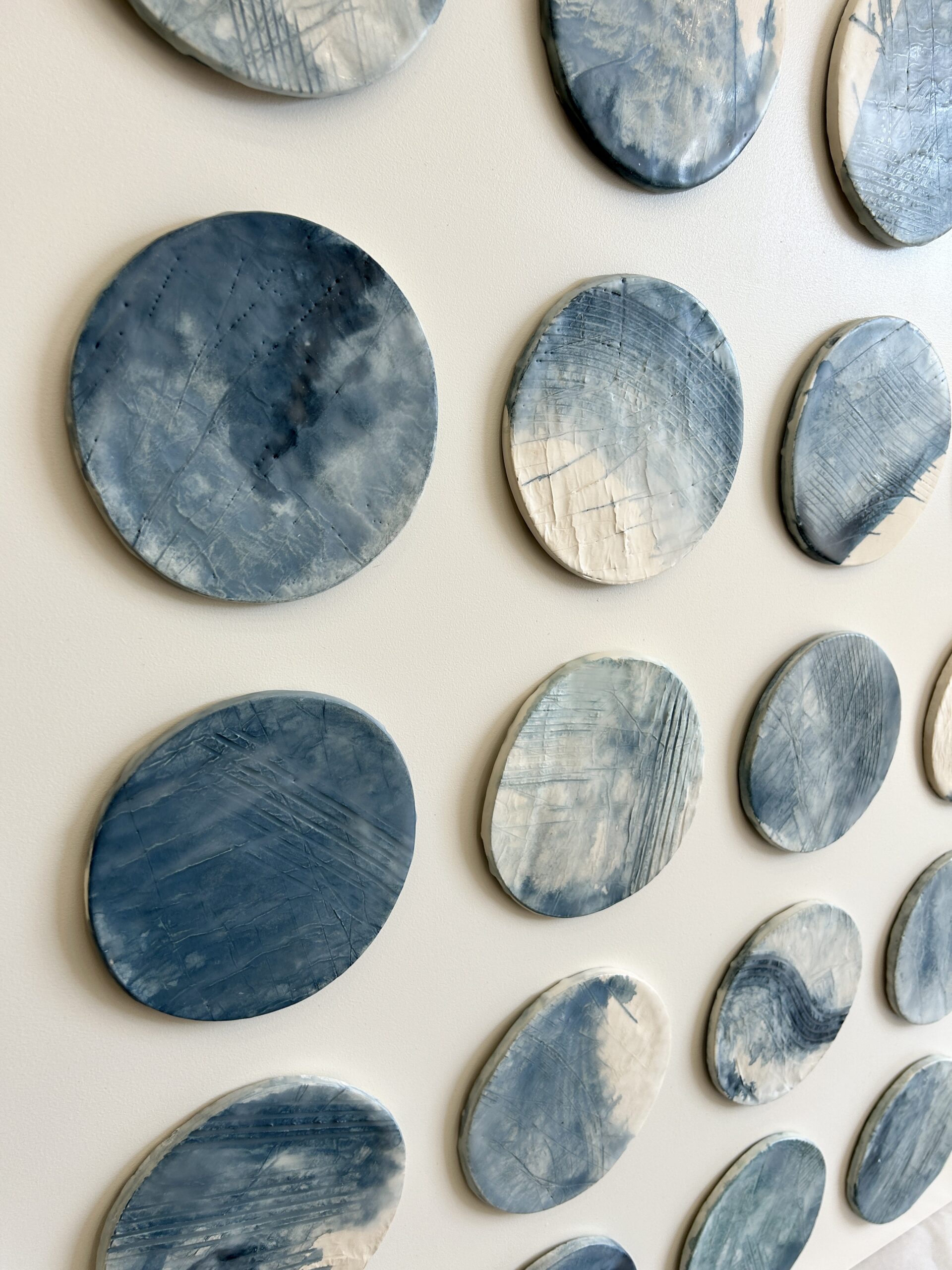 Emily Mann, Ink and Indigo, Custom Commisioned Paperclay and Encaustic Disks on Panel, set of 4, 38x38 each, custom art for luxury hospitality suites