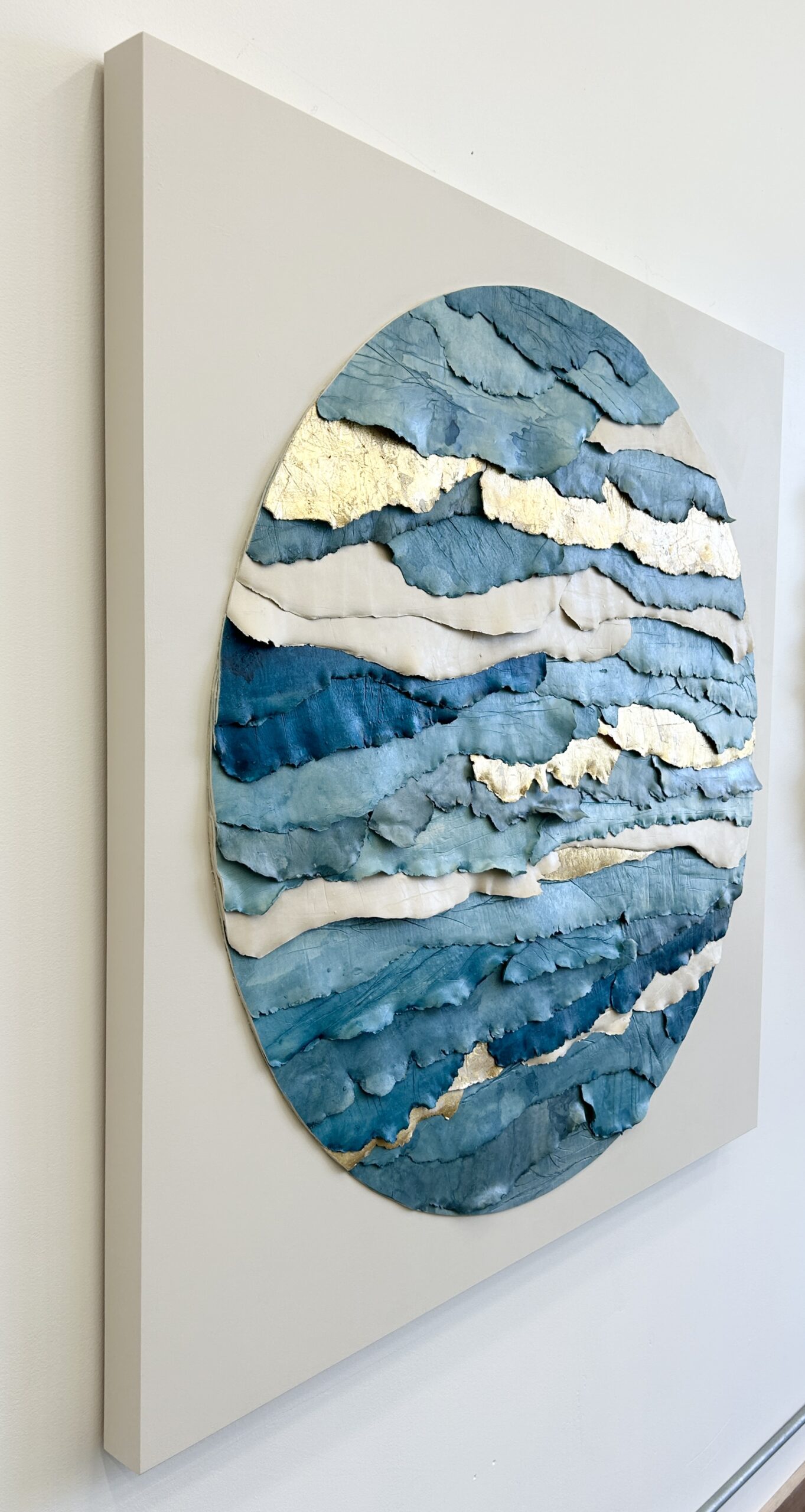 custom dimensional wall art by Emily Mann, Ink and Indigo, Circular Strata on Square Panel, Custom Dimensional Paperclay Assemblage with Watercolor and Gold Leafing on Cradled Panel, 45x45, side view