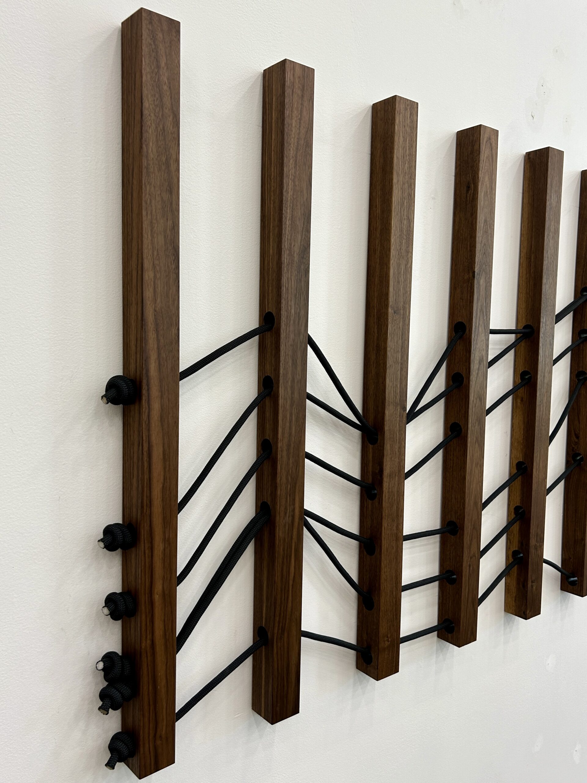 Emily Mann, Ink and Indigo, Wood + Woven Landscape 1, Custom Dimensional Wall Installation, Walnut Slats Woven through with Black Climbing Rope to represent Sedona Mountainscape, approximately 36h x 116w