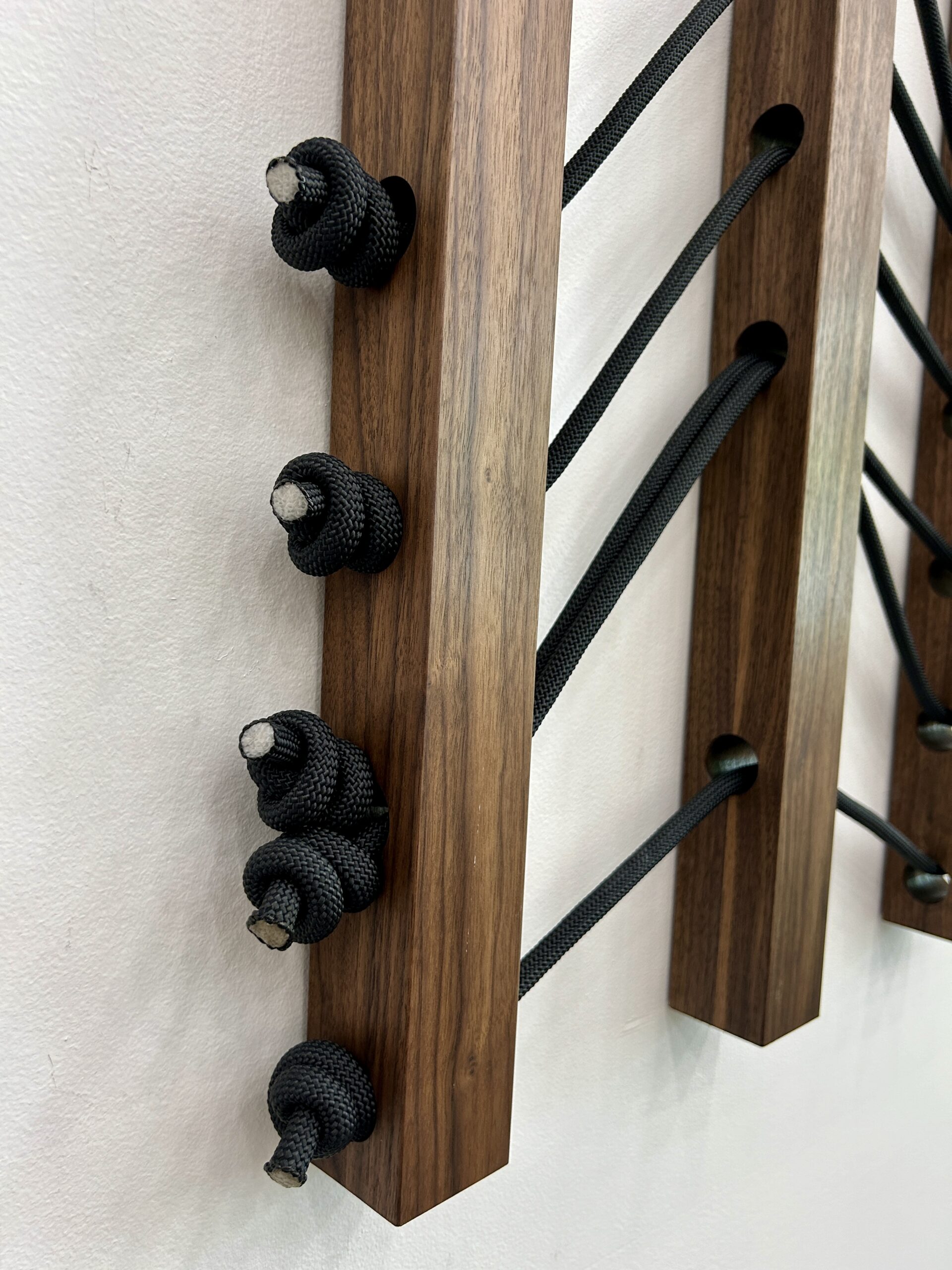 Emily Mann, Ink and Indigo, Wood + Woven Landscape 1, Custom Dimensional Wall Installation, Walnut Slats Woven through with Black Climbing Rope to represent Sedona Mountainscape, approximately 36h x 116w