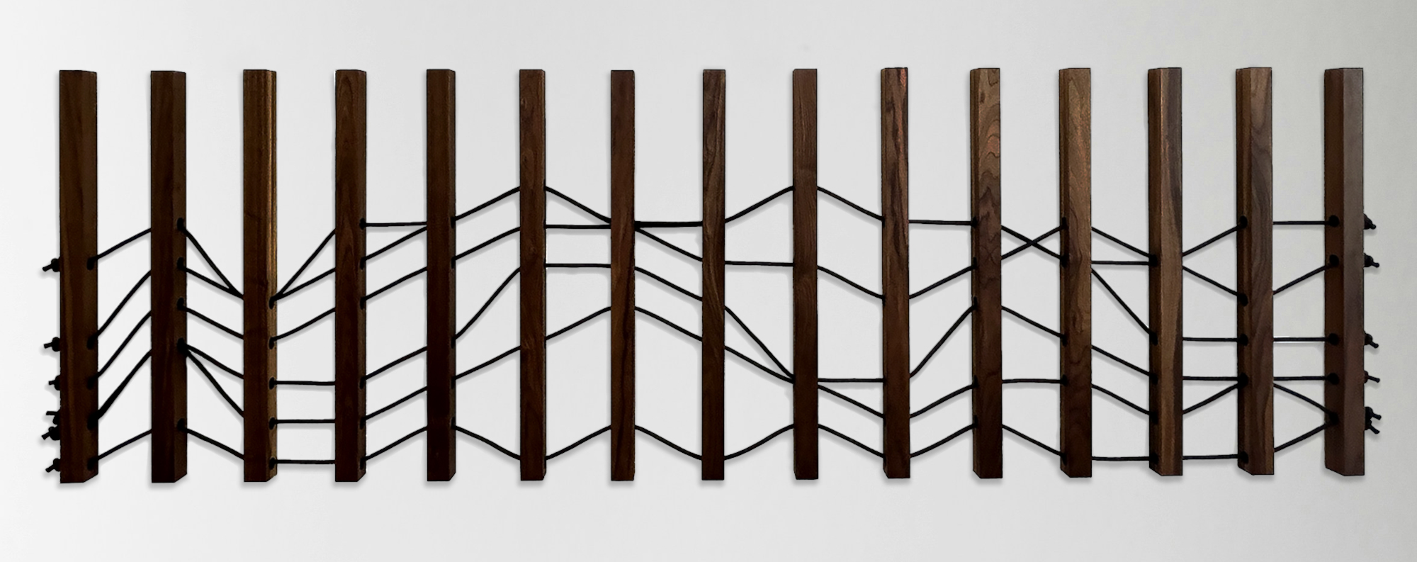 Emily Mann, Ink and Indigo, Wood + Woven Landscape 1, Custom Dimensional Wall Installation, Walnut Slats Woven through with Black Climbing Rope to represent Sedona Mountainscape, approximately 36h x 116w