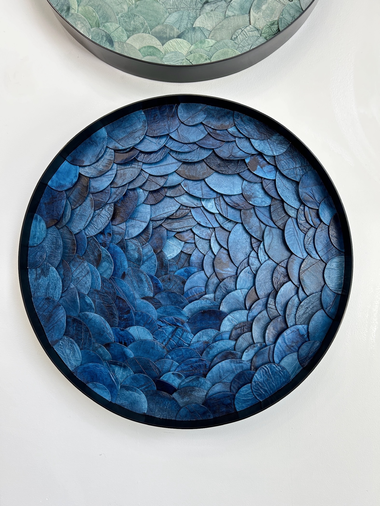 Custom dimensional wall art in Portal style, Japanese paperclay watercolor, mixed media in custom 24 " dia metal frame in black finish for hospitality project by Emily Mann of Ink and Indigo