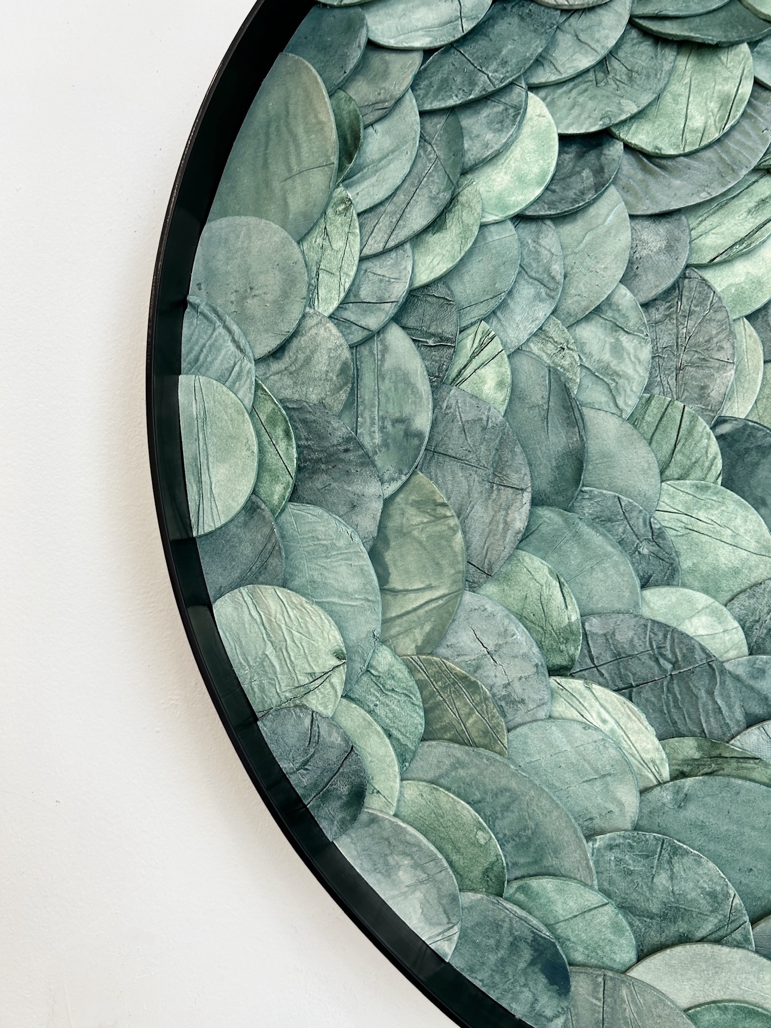 Custom dimensional wall art in Portal style, Japanese paperclay watercolor, mixed media in custom 24 " dia metal frame in black finish for hospitality project by Emily Mann of Ink and Indigo