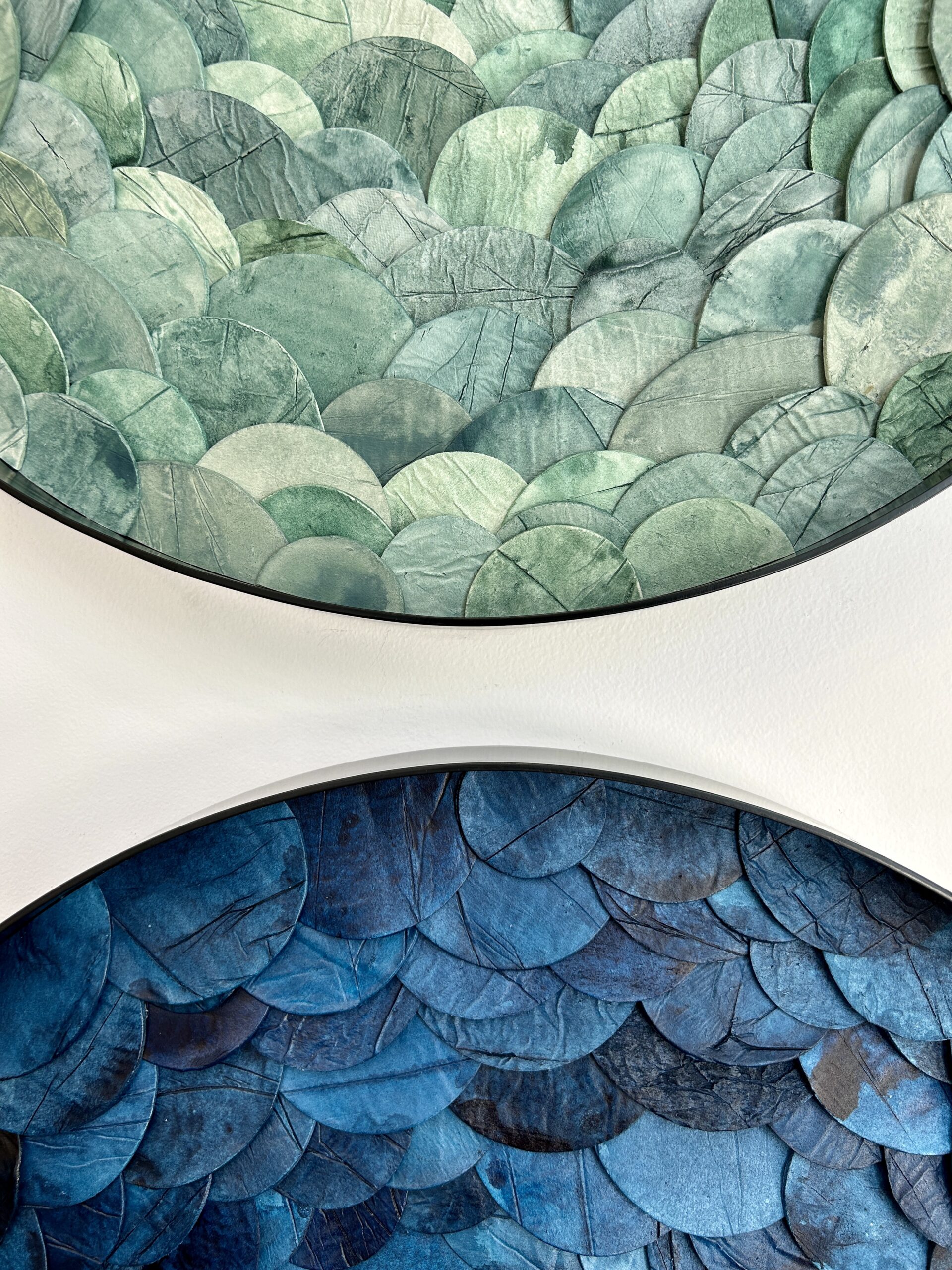 Custom dimensional wall art in Portal style, Japanese paperclay watercolor, mixed media in custom 24 " dia metal frame in black finish for hospitality project by Emily Mann of Ink and Indigo