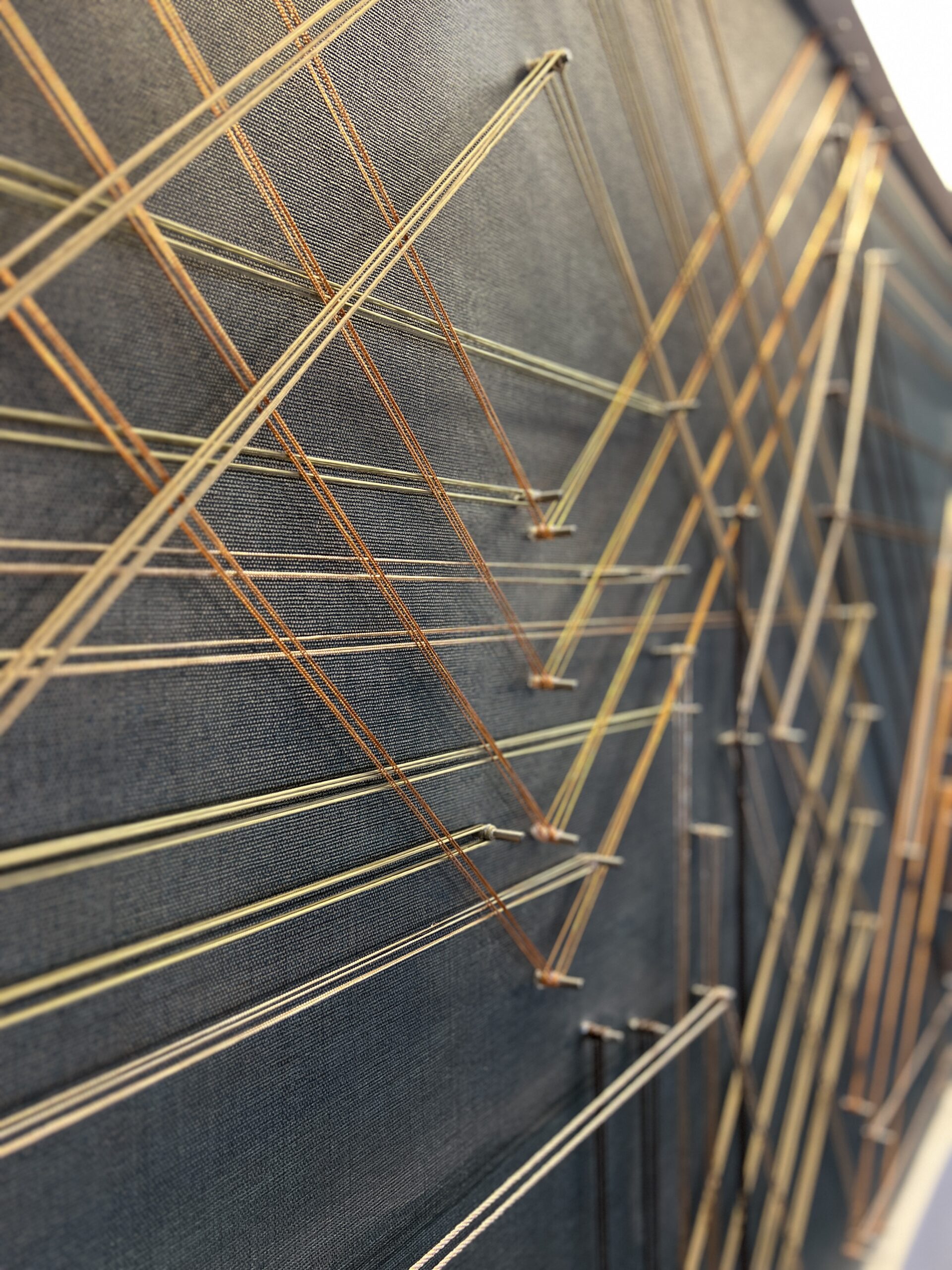 Custom Site Installation at the Georgia Tech Hotel + Conference Center Reception Desk, String, steel pegs, mixed media, 5’-2”H x 12’-2” W | Interior Design by TVS | Art Consulting by DAC