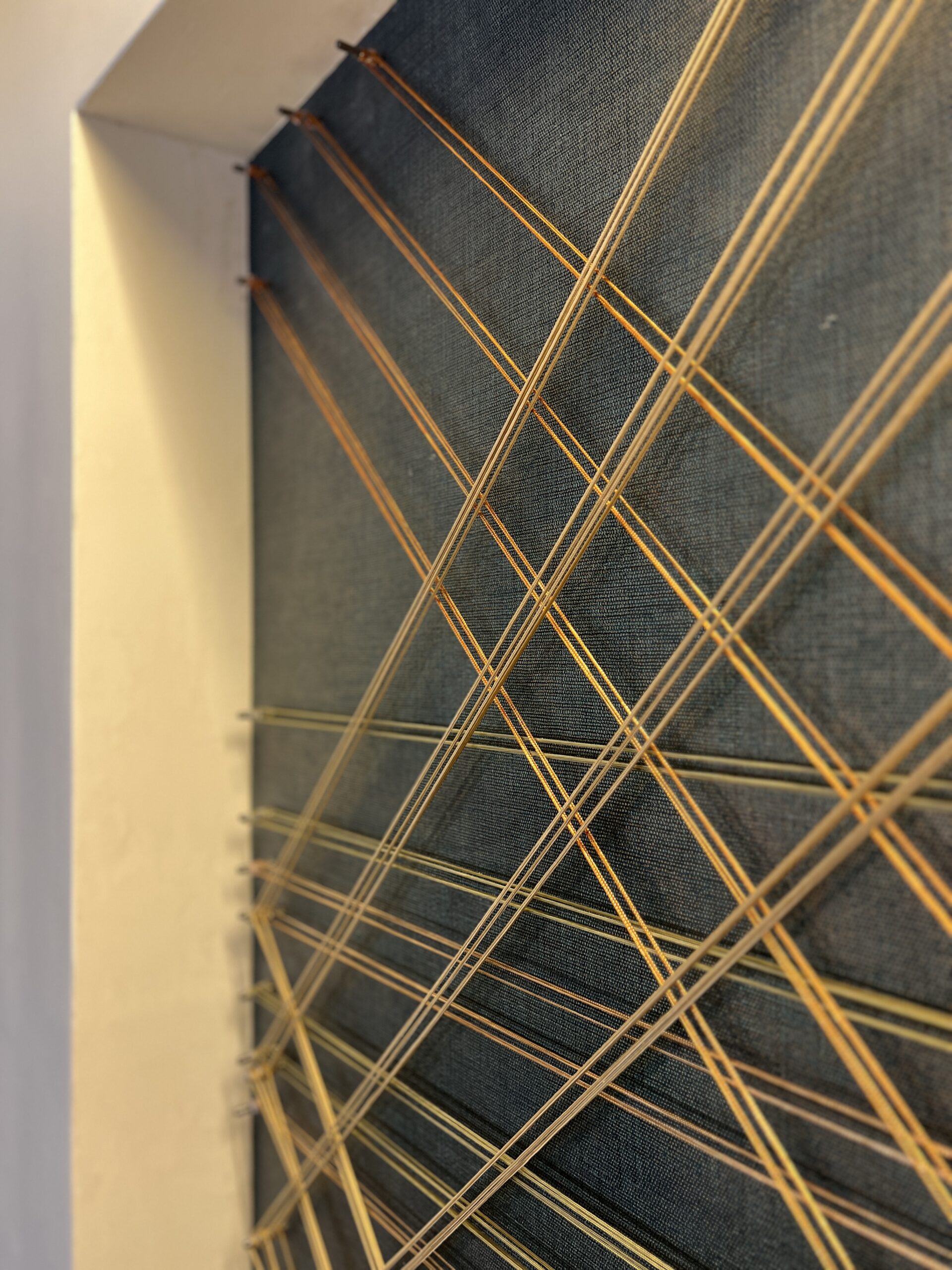 Custom Site Installation at the Georgia Tech Hotel + Conference Center Reception Desk, String, steel pegs, mixed media, 5’-2”H x 12’-2” W | Interior Design by TVS | Art Consulting by DAC