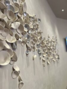 Emily Mann, Ink and Indigo, Custom Installation for Red Rock Casino High Limit, paperclay cups with silver leaf, approx 5’ x 14’ installation on curved wall-5