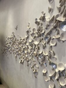 Emily Mann, Ink and Indigo, Custom Installation for Red Rock Casino High Limit, paperclay cups with silver leaf, approx 5’ x 14’ installation on curved wall-5