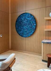 Emily Mann, Ink and Indigo, Large Portal, paperclay dimensional wall sculpture in custom round metal frame, 56 in diameter installation view at Evermore Resort