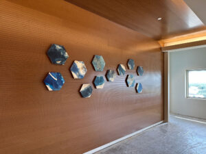 Ink and Indigo, Hex Clay Dimensional Wall Art Installation View at Methodist Richardson Medical Center, paperclay and encaustic hex forms with botanical imprints, approx 12-15 in each