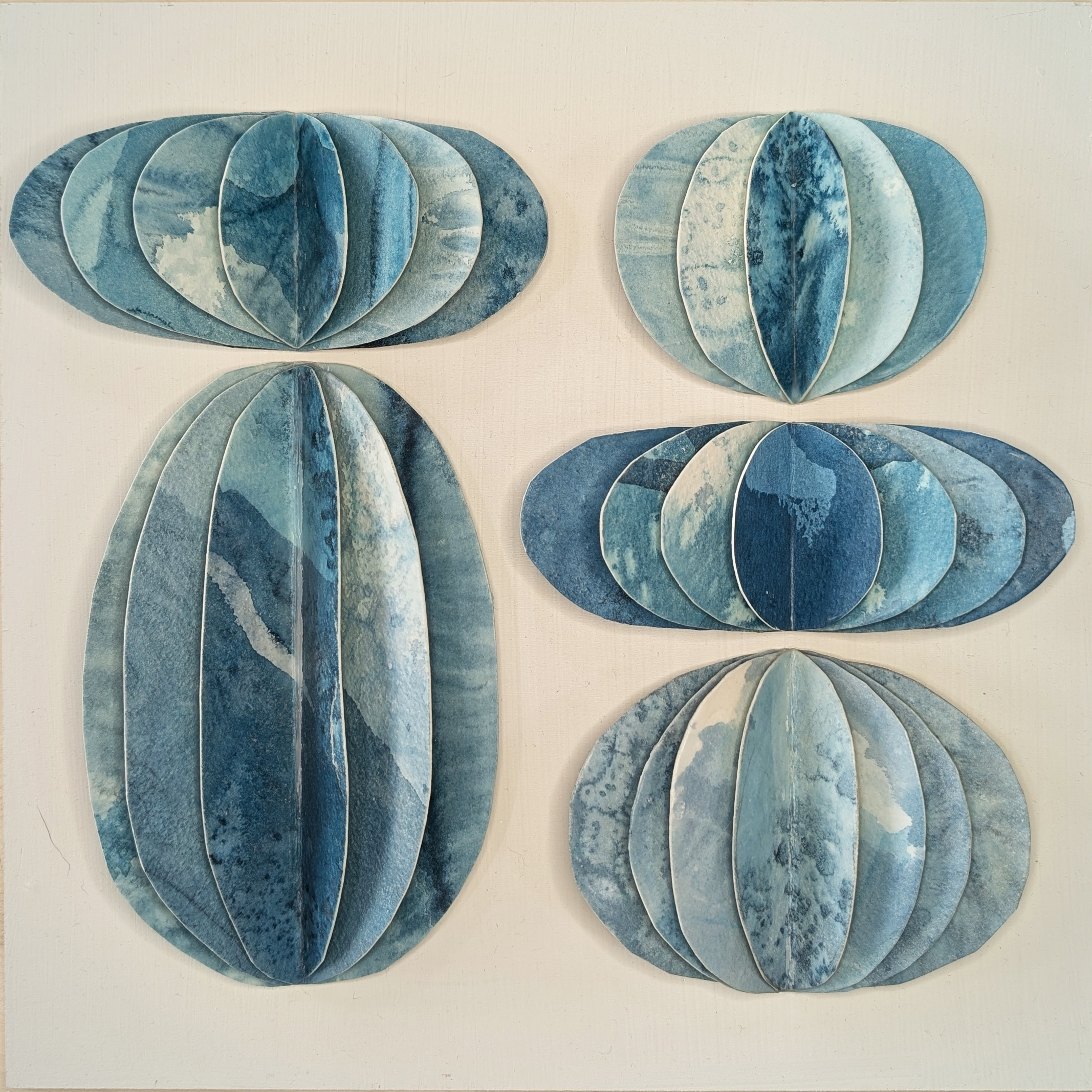Ink and Indigo, Custom Dimensional Art for Hospitality and Interior Design, Fluted Forms in Blue (Sample) | dimensional mm sculptural paper and encaustic on panel | dimensions and finishes variable